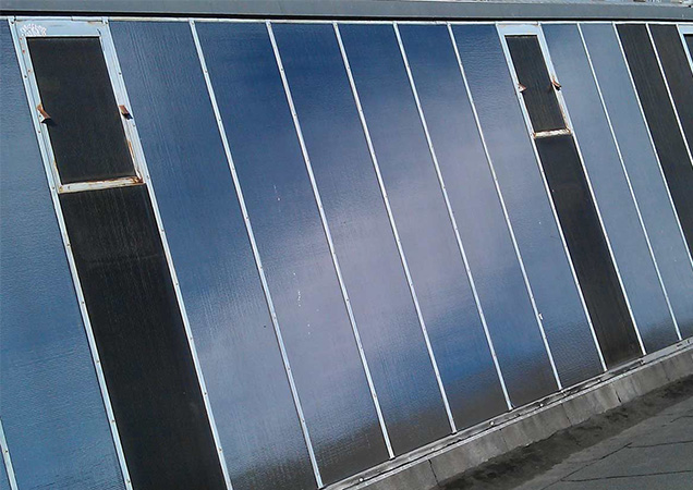 Schräges Drahtglas mit Sonnenschutzfolie von Hahn Sonnenschutz